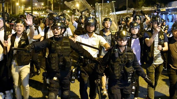 Police face-off against protesters during clashes after a rally against amendments to the extradition bill