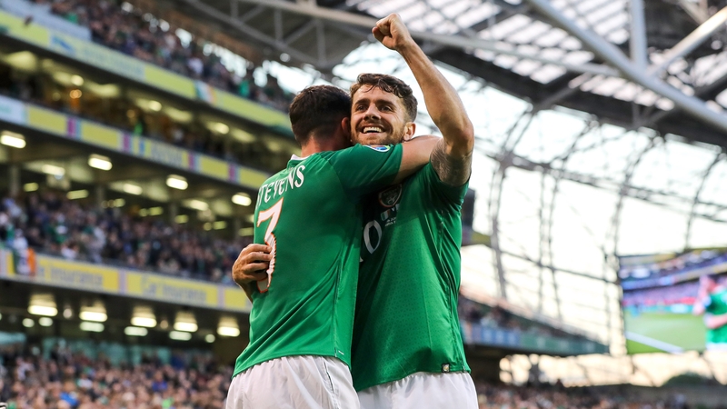 Robbie Brady celebrates his goal with Enda Stevens