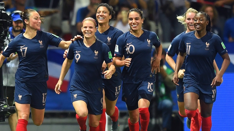 Eugenie Le Sommer of France celebrates with teammates