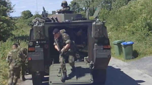 Soldiers patrolling perimeter fence at Shannon Airport (2004)