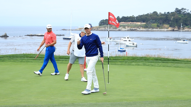 Rory McIlroy waves to the crowd on the fifth green