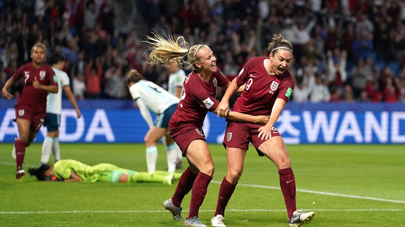 Jodie Taylor (r) celebrates her goal with Beth Meade