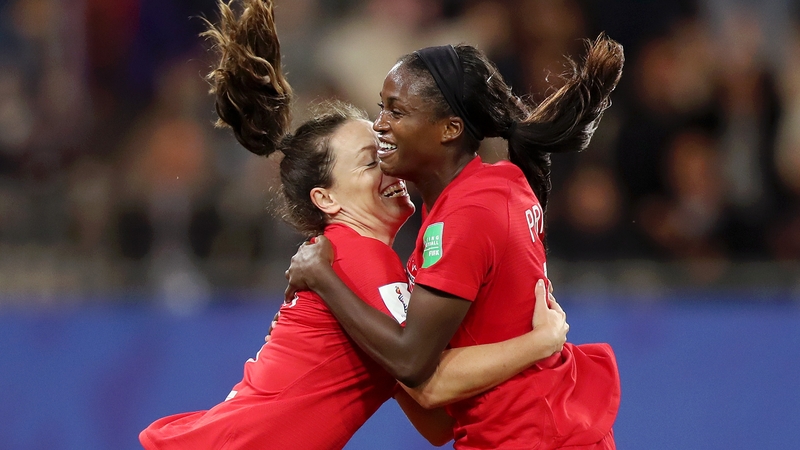 Nichelle Prince of Canada celebrates with teammate Allysha Chapman after scoring her team's second goal