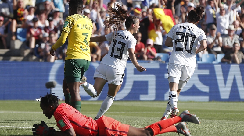 Sara Daebritz (C) of Germany celebrates scoring