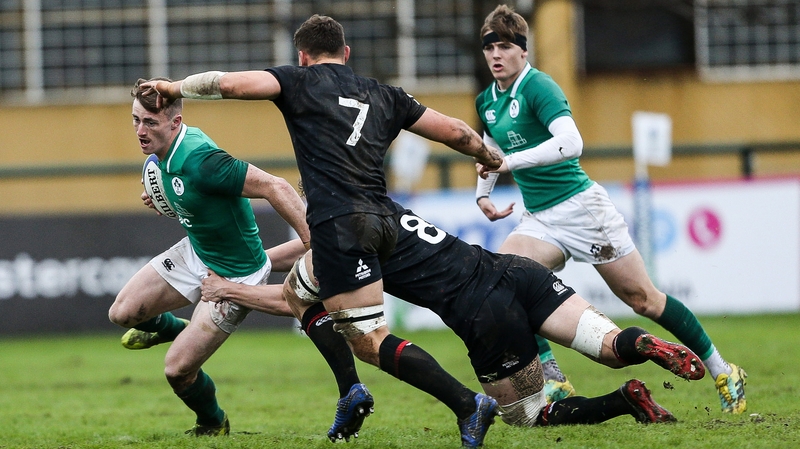 Ireland winger Jonathan Wren is tackled by England's Ted Hill in Rosario