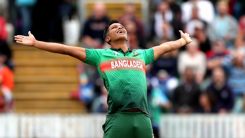 Mohammad Saifuddin celebrates taking the wicket of West Indies' Chris Gayle for a duck