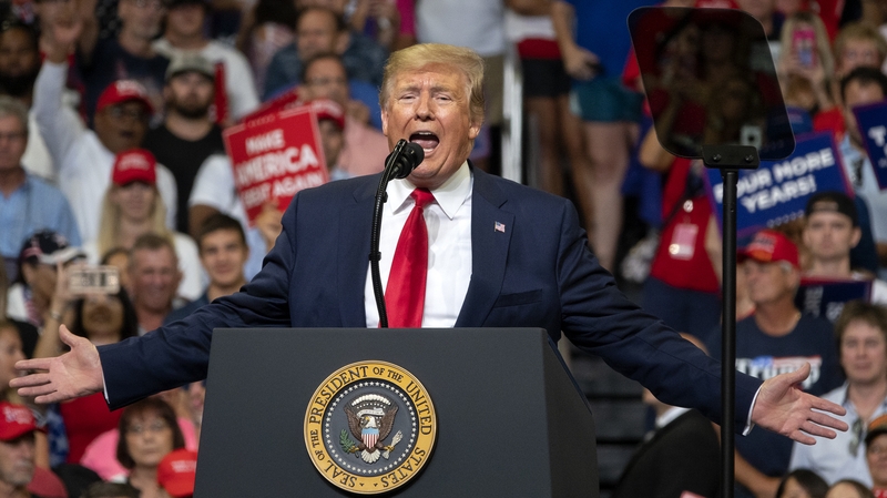 Donald Trump dismissed the latest polls showing him trailing his rival as fake