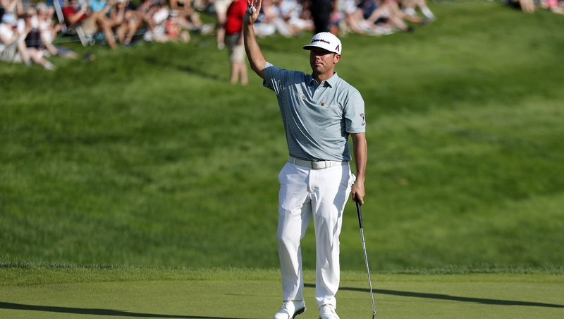 Chez Reavi salutes the crowd after winning the Travelers Championship