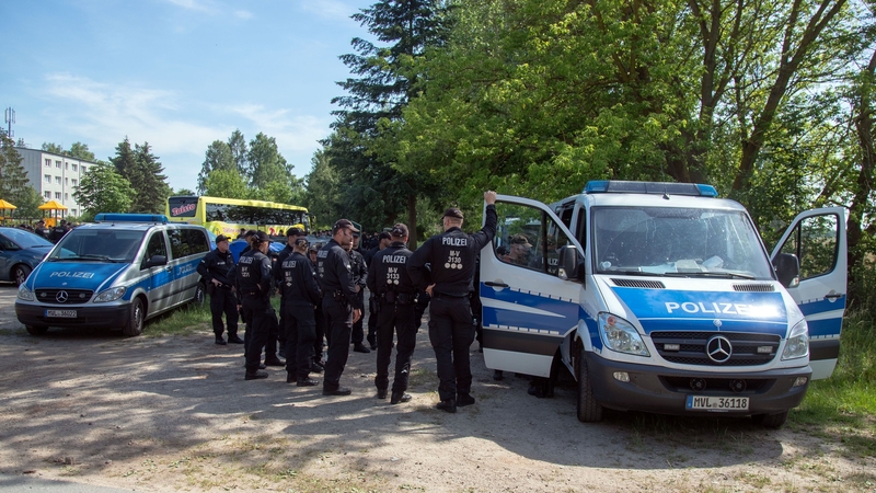 Police at the entrance to the site of the crash