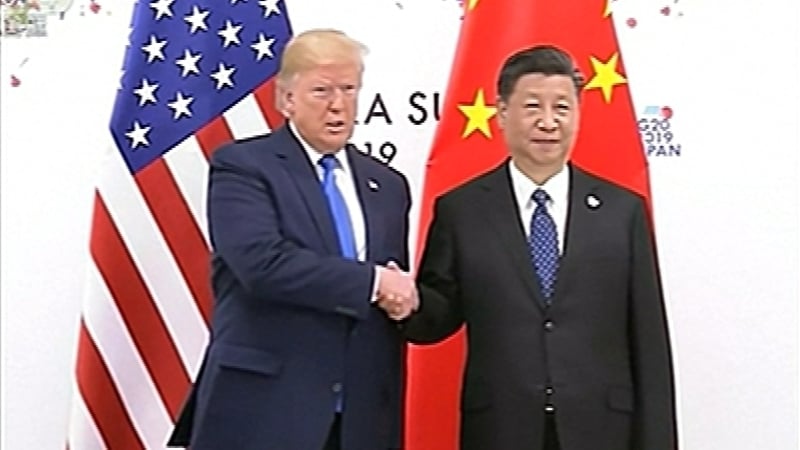 A presidential grip-and-grimace: Donald Trump and Xi Jinping frown for the cameras