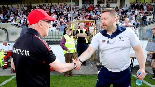 Cian O'Neill shakes hands with Mickey Harte after the game