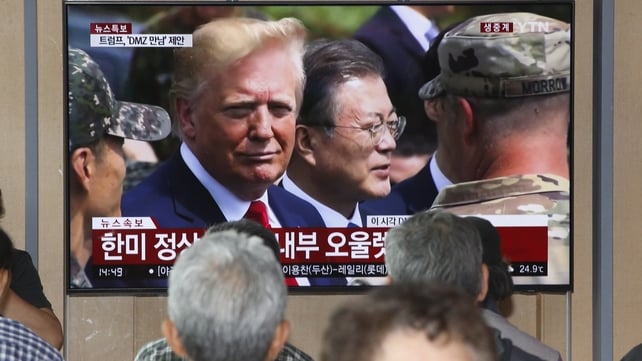 The public watches as Donald Trump tours the Demilitarised Zone