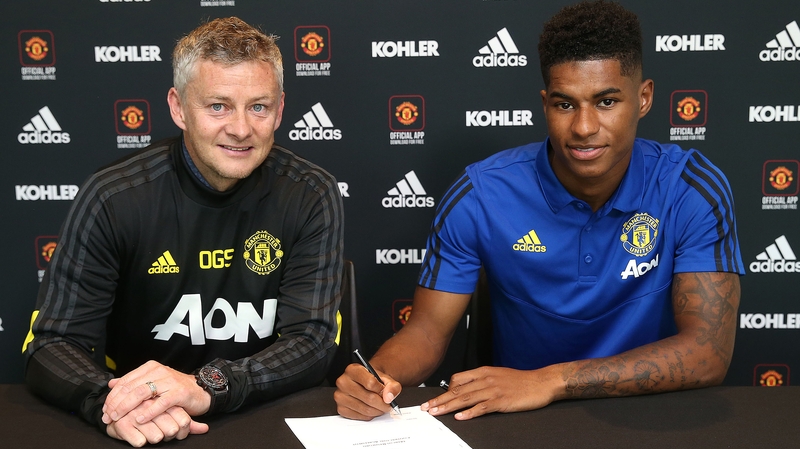 Marcus Rashford puts pen to paper as he commits to four more years at United