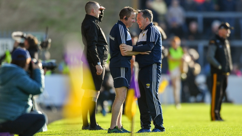Bulfin and Fitzgerald consult on the sideline