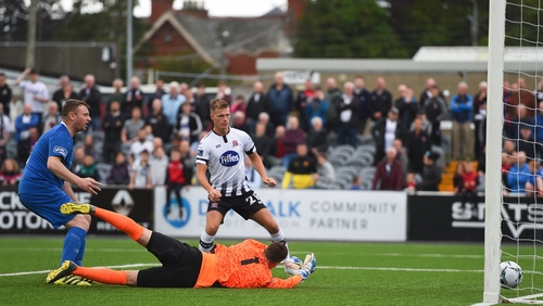 Kenny Browne (L) scores an own-goal