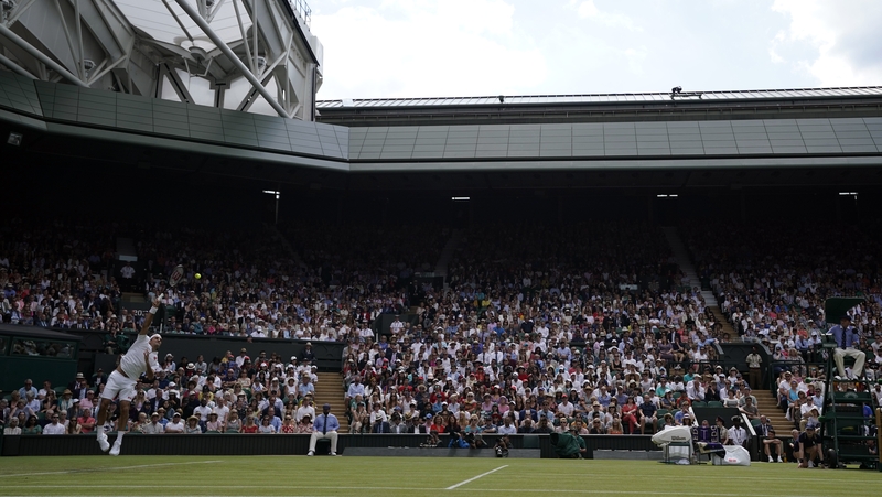 Roger Federer serves to Lloyd Harris