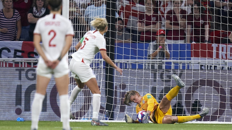 Alyssa Naeher saves from the penalty spot