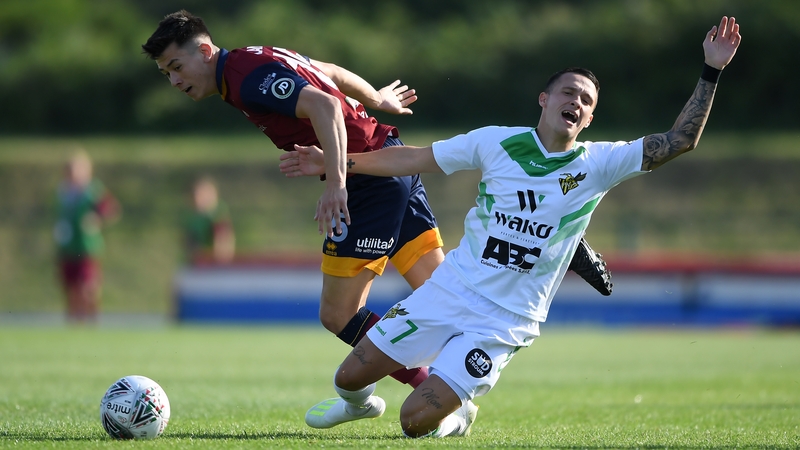 Mayron De Almeida of FC Progres Niederkorn (R) is tackled by Jordan Lam of Cardiff Met FC
