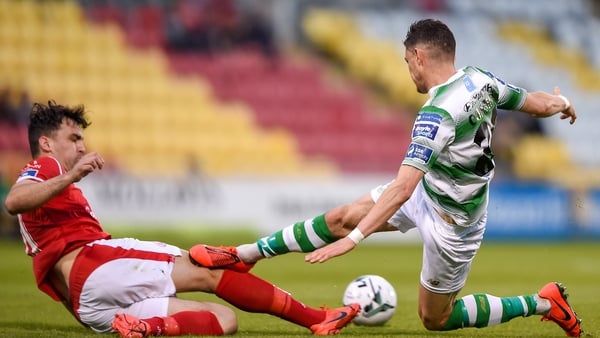 Graham Cummins of Shamrock Rovers in action against John Mahon of Sligo Rovers