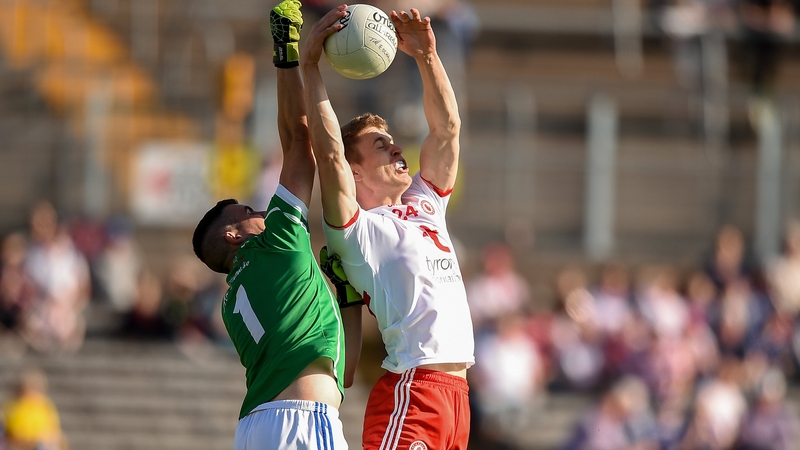 Ben McDonnell catches the high ball ahead of Raymond Galligan before scoring the only goal of the game