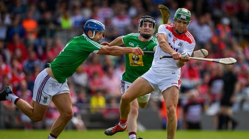 Alan Cadogan scores a point despite pressure from the Westmeath backs