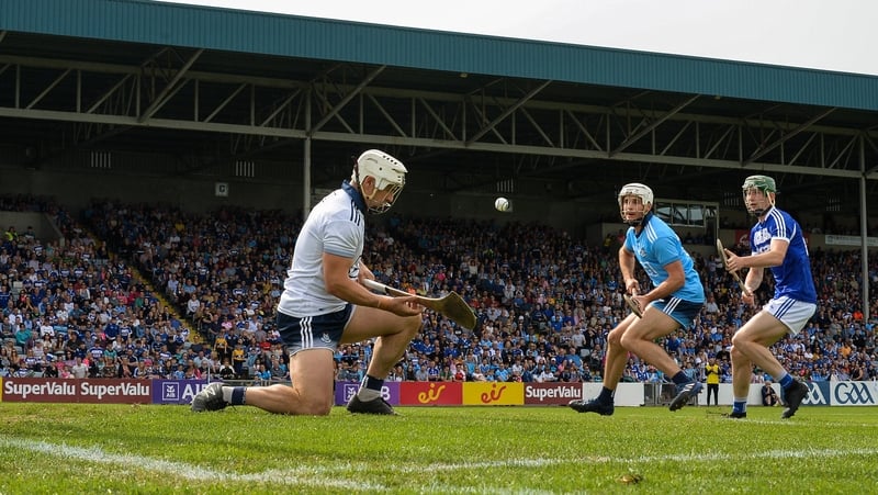 Laois' Aaron Dunphy scores a goal past Dublin goalkeeper Alan Nolan at O'Moore Park