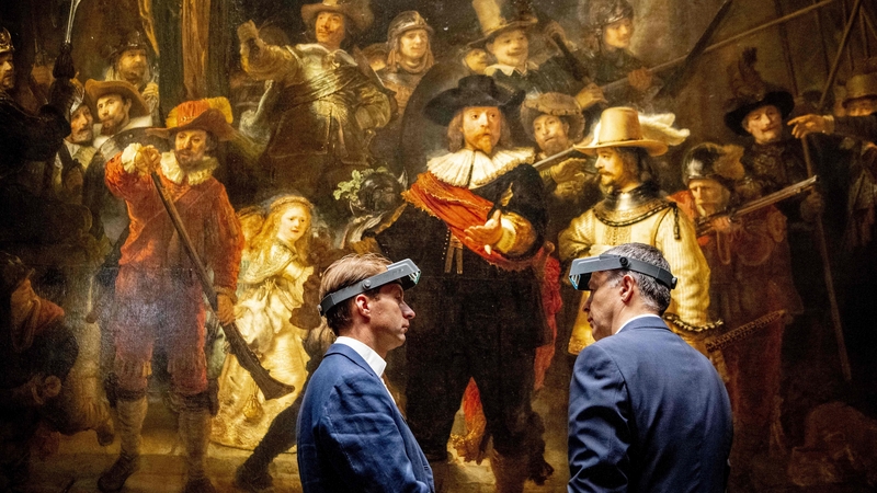 Taco Dibbits (L) and Thierry Vanlancker CEO of AkzoNobel standing before 'The Night Watch'