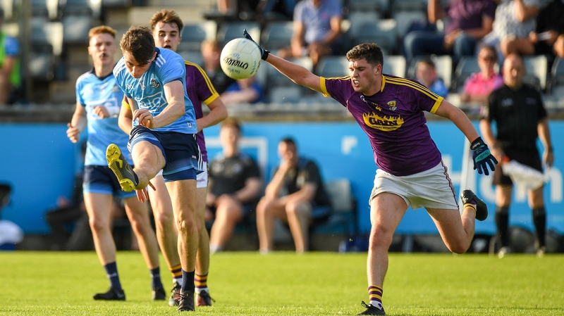 Ross McGarry fires over a point for Dublin
