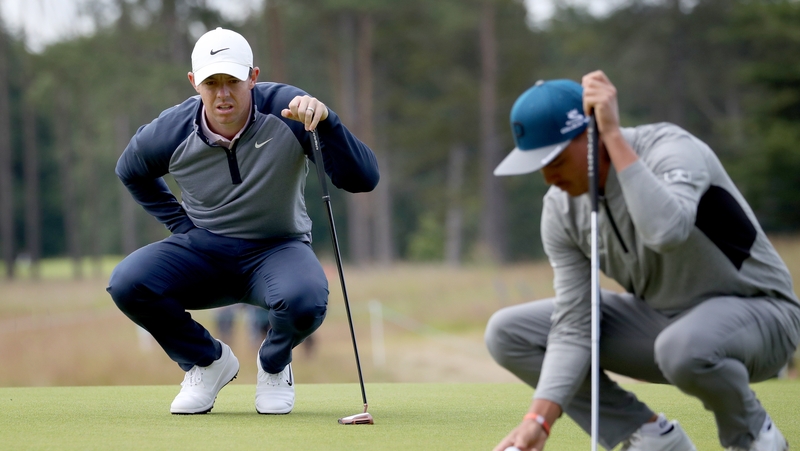 Rory McIlroy and Ricky Fowler concentrating on the 13th green