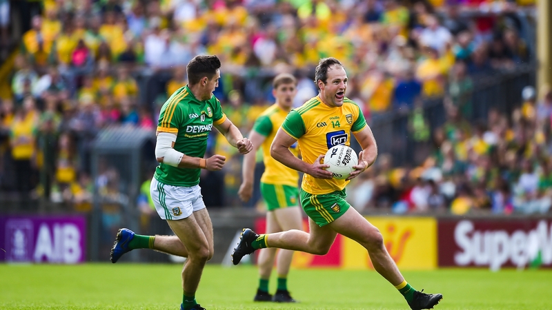 Michael Murphy of Donegal in action against Ethan Devine of Meath