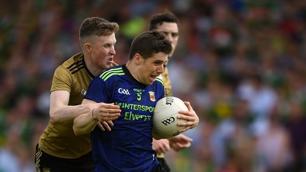 Lee Keegan of Mayo is tackled by Jason Foley of Kerry