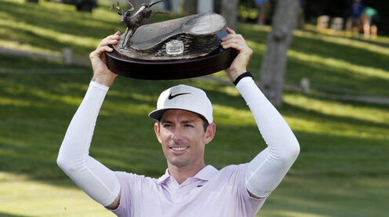 Dylan Frittelli poses with the trophy