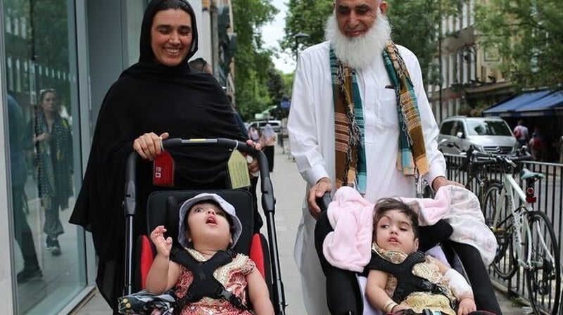 The twins were discharged from hospital earlier this month after three major operations