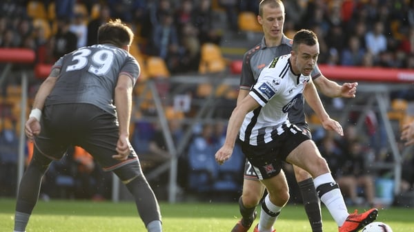 Robbie Benson of Dundalk in action against Riga