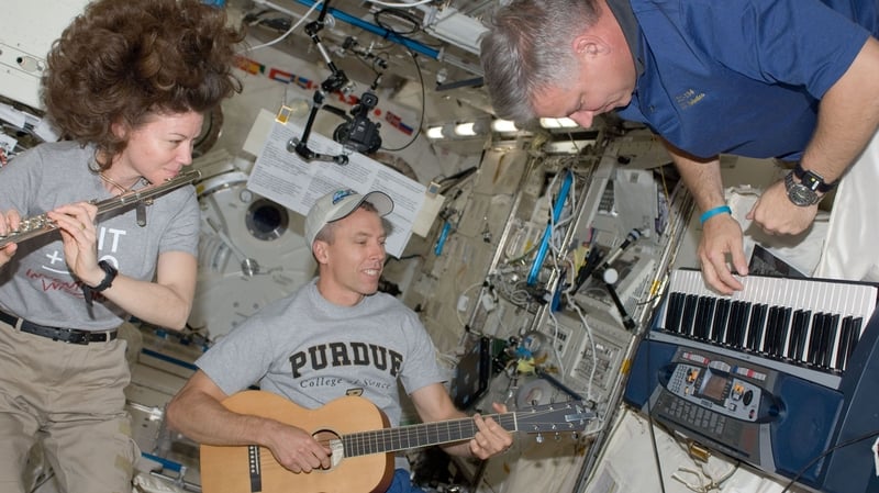 Catherine 'Cady' Coleman playing music is space