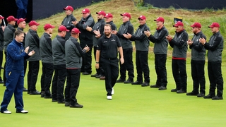 Shane Lowry on his way to accepting the Claret Jug