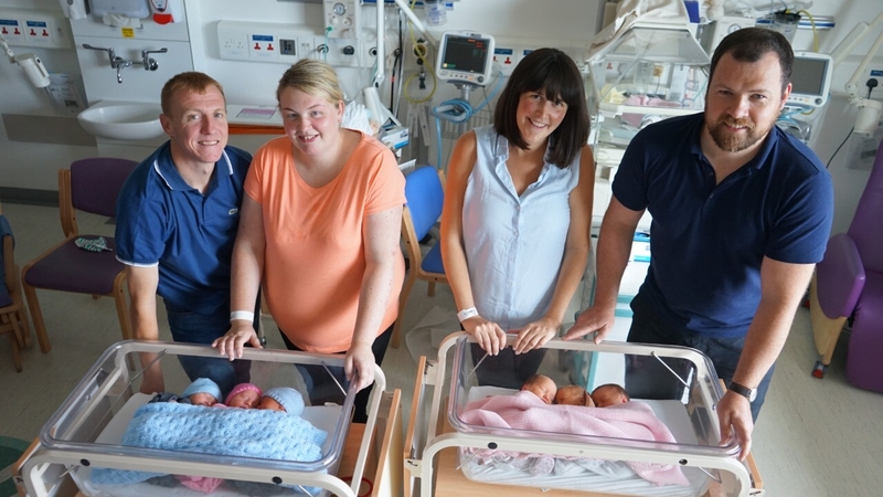 Brendan and Kirsty McMenamin and their children, with Claire and Johnny Stewart and their three baby girls
