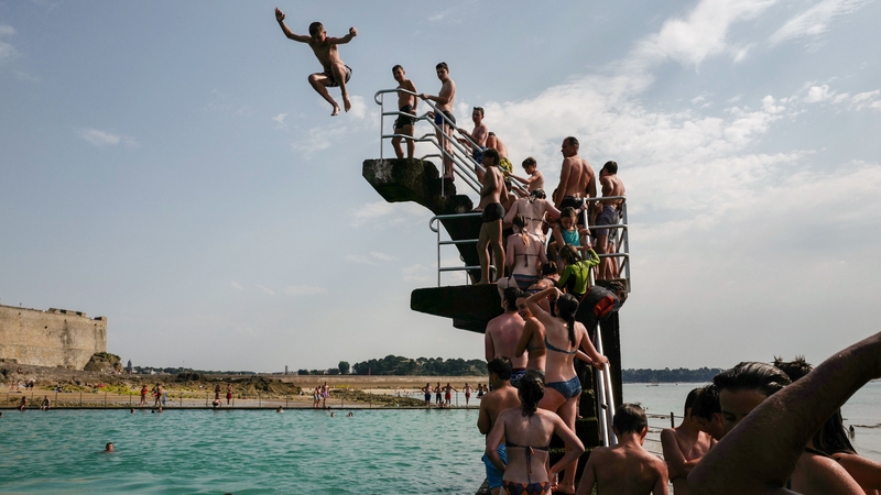 People queue to dive into the landmark sea pool of Saint-Malo, Brittany, France
