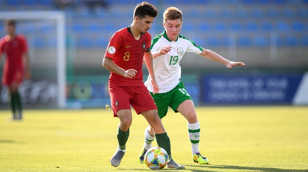 Vitor Ferreira of Portugal and Brandon Kavanagh battle for possession