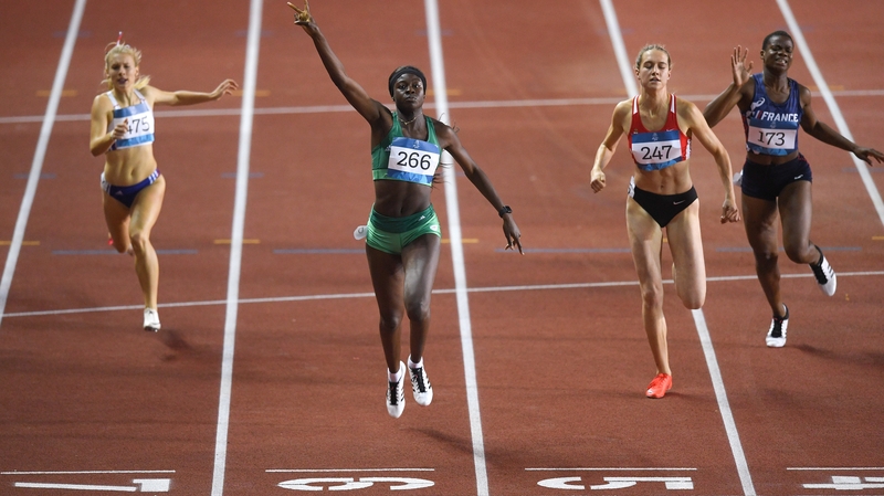Rhasidat Adeleke celebrates as she crosses the line