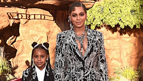 The mini celebrity is regularly seen in couture and clutching designer handbags.
