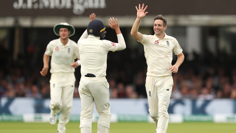 Chris Woakes (right) celebrates the catch of Ireland' Stuart Thompson