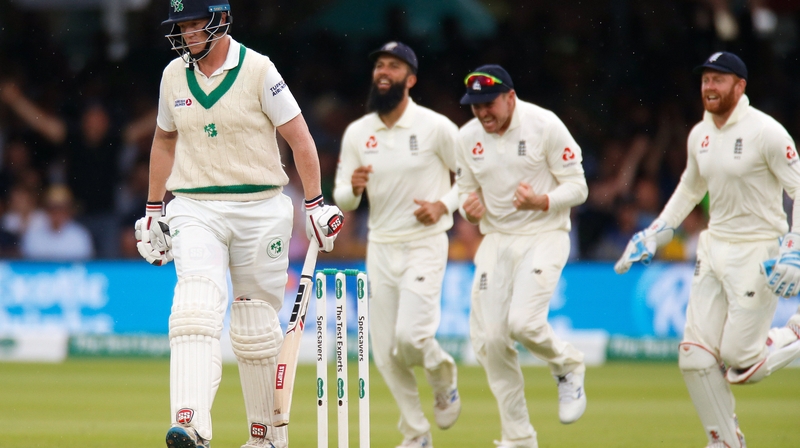 England celebrate taking the wicket of Kevin O'Brien