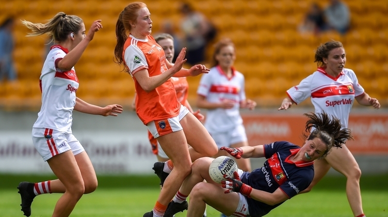 Martina O'Brien of Cork makes a save despite the shot of Blaithin Mackin of Armagh