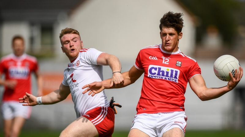 Colm O'Callaghan of Cork in action against Conall Devlin of Tyrone