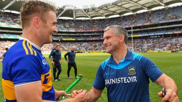 Noel McGrath with his manager Liam Sheedy after the game