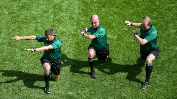 Referee Sean Cleere warms-up with linesmen, Colm Lyons, left, and Johnny Murphy, ahead of the All-Ireland semi final between Wexford and Tipperary at Croke Park. Photo: Daire Brennan/Sportsfile via Getty Images