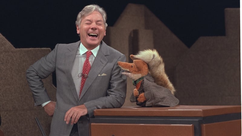 Gay Byrne shares a joke with Basil Brush on the The Late Late Show in 1983