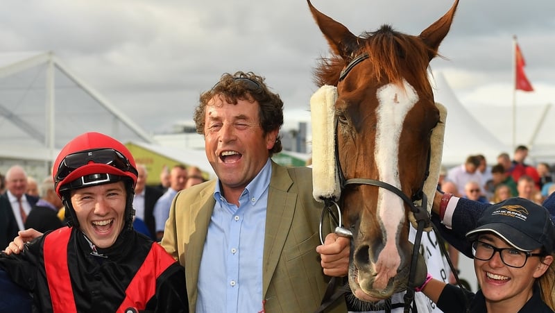 Jockey Colin Keane and trainer Adrian McGuinness celebrate after sending out Saltonstall
