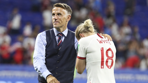 Phil Neville (L) and England's Ellen White (R) react after England's World Cup semi-final defeat to the USA last year